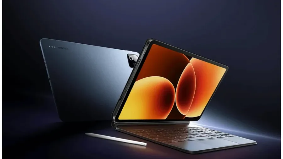 Xiaomi Pad tablet render showing a large display, rear camera module, stylus, and keyboard accessory